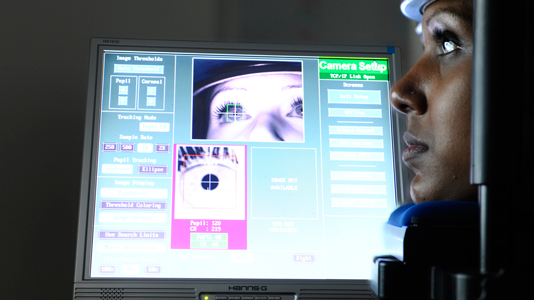 A student using the eye-tracking facility