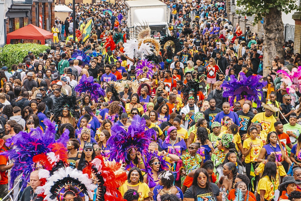 lots of people at a busy street carnival