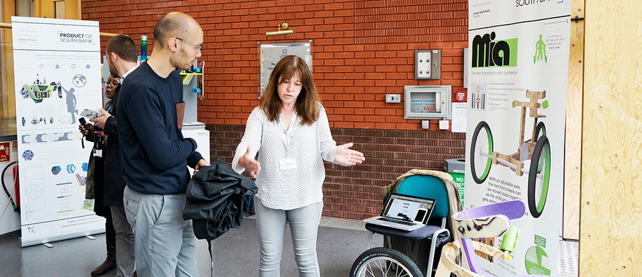 two people discuss tricycle design