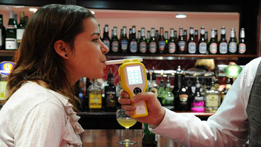 A participant being breathalysed in the Pub Lab