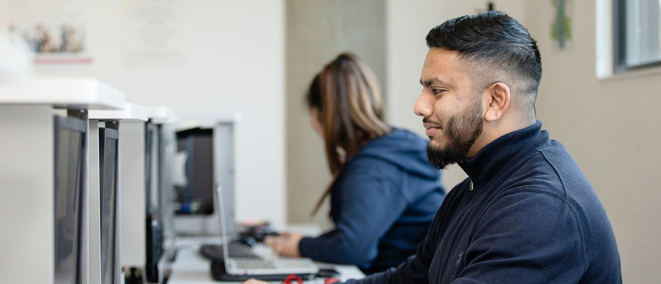 Man looks at computer