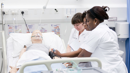 Three nurses working on SimMan