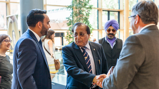 Dr Rami Ranger CBE greets Professor Paul Ivey, LSBU’s Pro Vice Chancellor for Research and Engagement