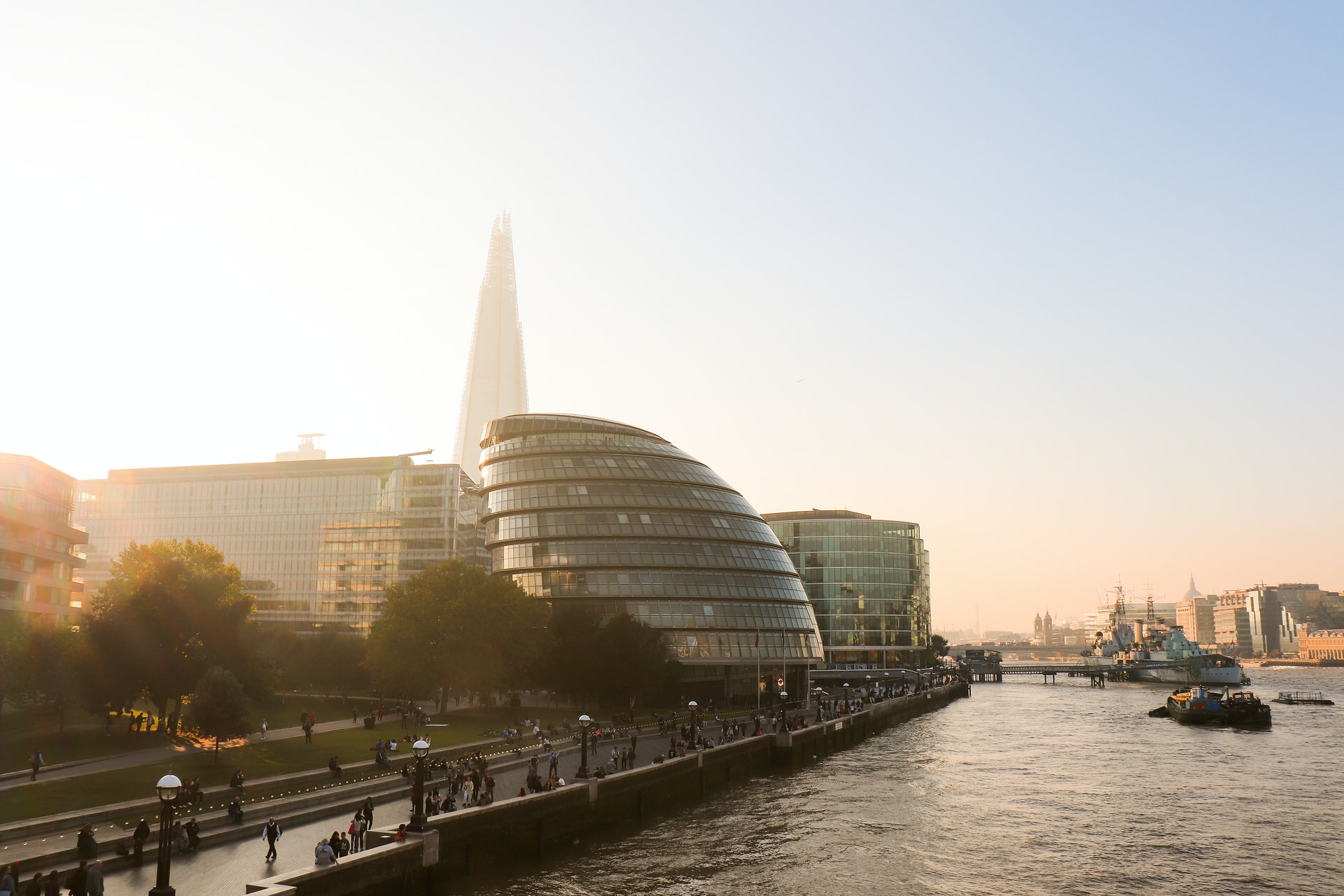 kidney shaped building in front of pointy building