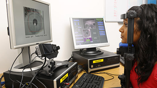 A student using the eye-tracking facility