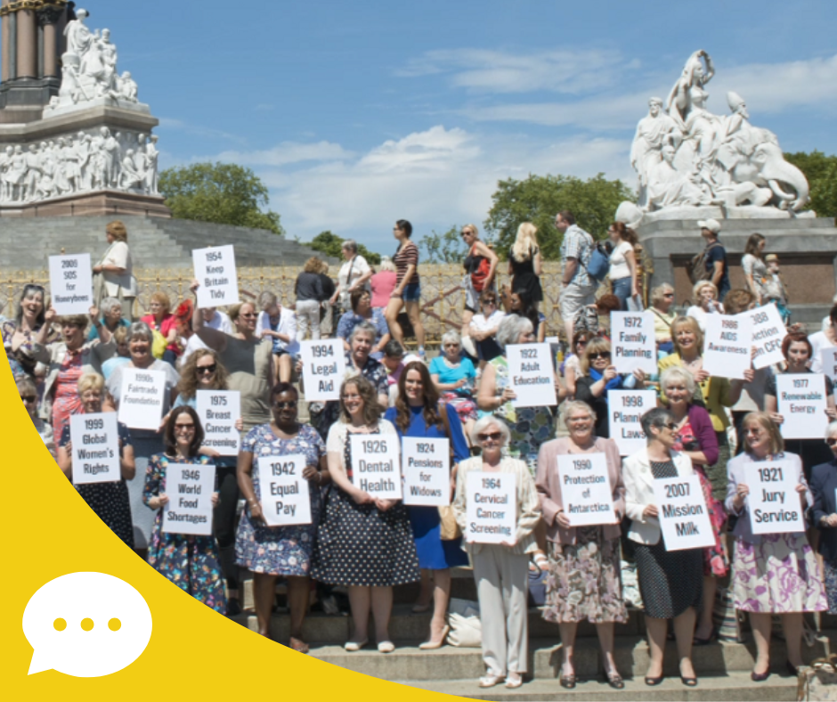 Group of WI members holding dates of significant campaigns